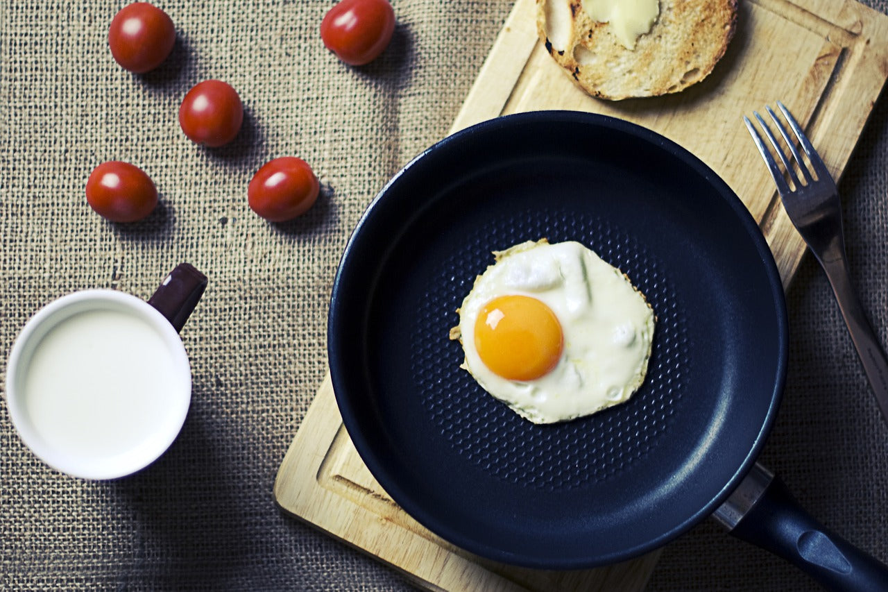 egg cooking in non-stick pan